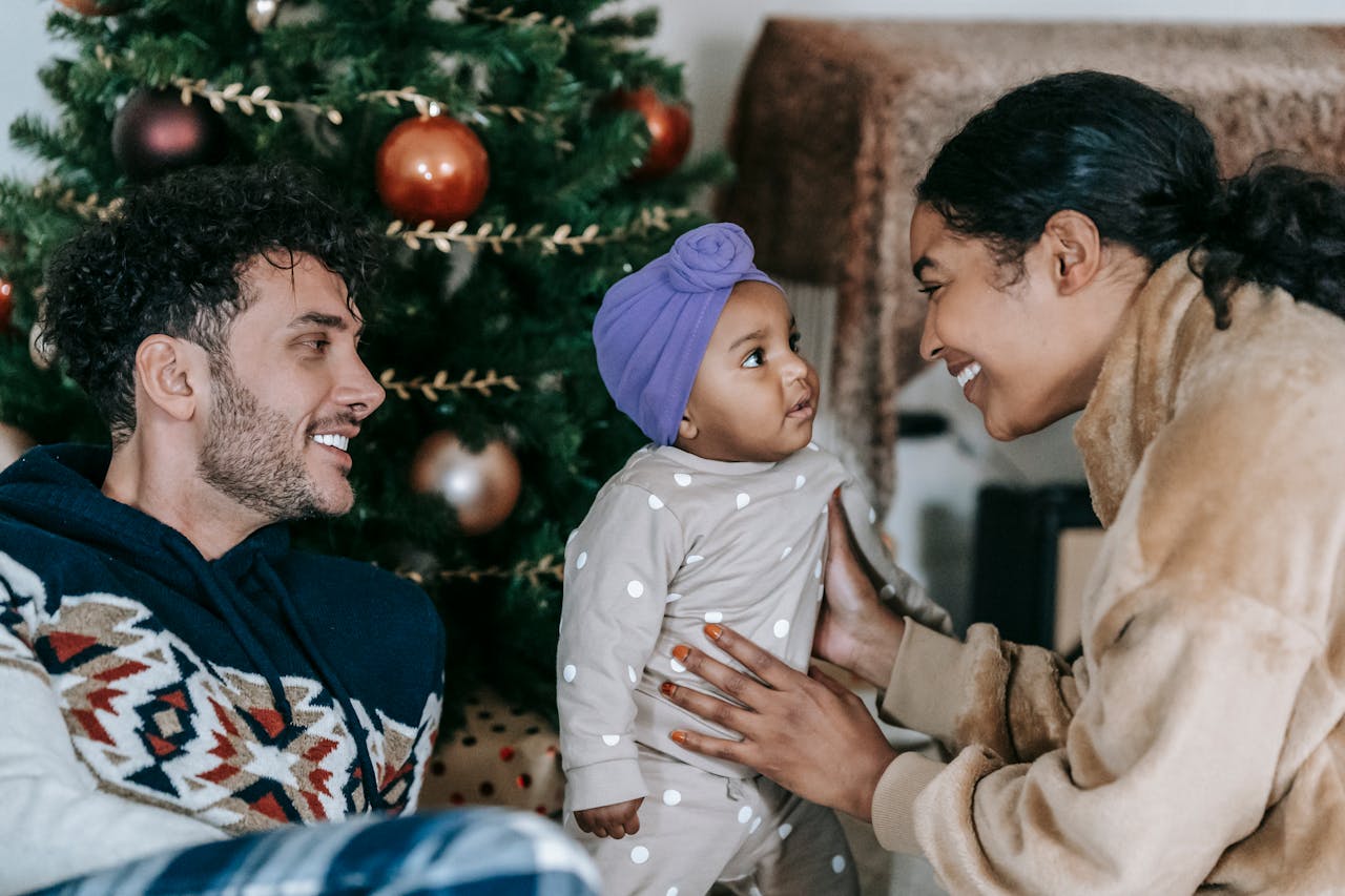dark skinned family with Christmas tree