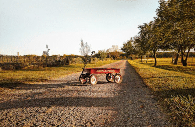 red flyer wagon on rural kansas road